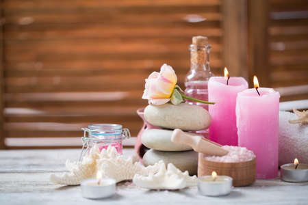 Beautiful composition of spa treatment on white wooden table