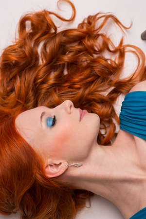 Young woman with long red hairの写真素材