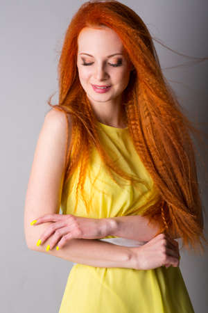 Young woman with long red hairの写真素材