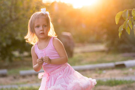 Girl child on the street, baby three years of ageの写真素材