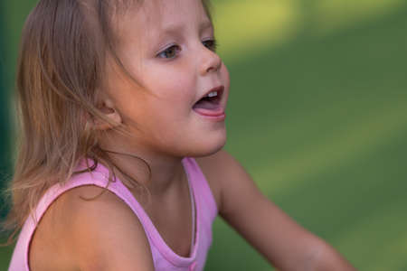 Girl child on the street, baby three years of ageの写真素材