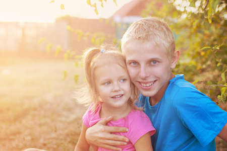 Brother and sister on a walk,  boy and girl are walkingの写真素材