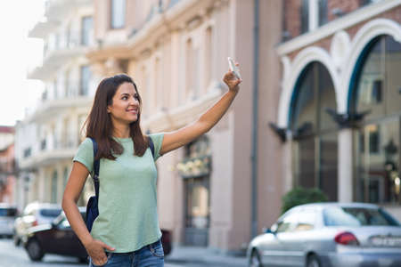 beautiful young girl walking around the cityの写真素材