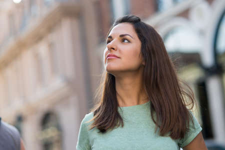 beautiful young girl walking around the cityの写真素材