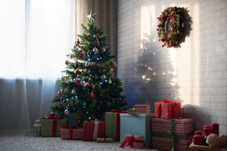 room with a decorated Christmas tree and gifts. Happy Christmas!の写真素材