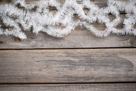 white tinsel on old wooden boardsの写真素材