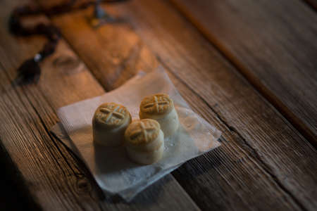 Prosfora from the Orthodox Church and a burning candleの写真素材