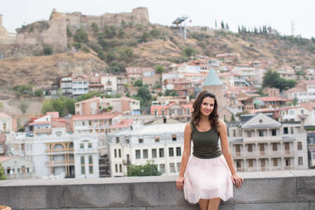 beautiful young girl walking around the city 