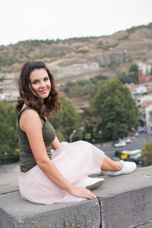 beautiful young girl walking around the city 