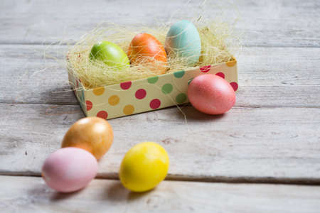 Easter eggs on wooden, Painted Easter eggs on old boards , Easter backgroundの写真素材