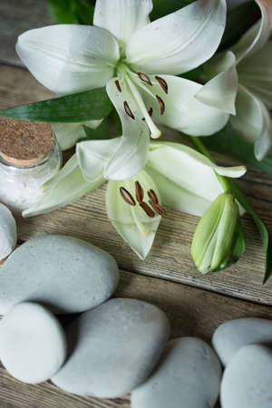 Beautiful composition of spa treatment on white wooden table の写真素材