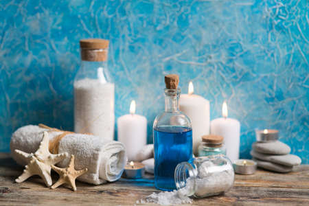Beautiful composition of spa treatment on white wooden table 