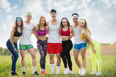 Group of sports people on the grass, young stand on the fieldの写真素材