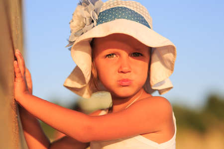 A girl of four years is resting on the seaの写真素材