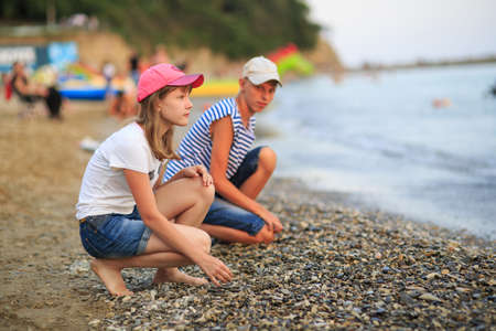 Children playing on the beachの写真素材