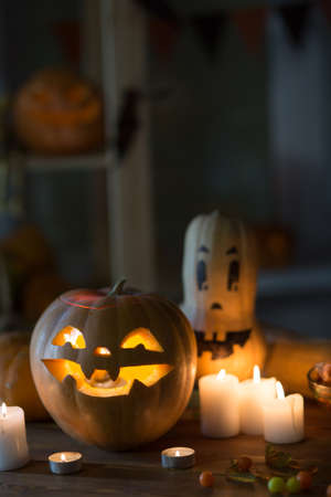 Pumpkin and candy on the table in the celebration of Halloweenの写真素材