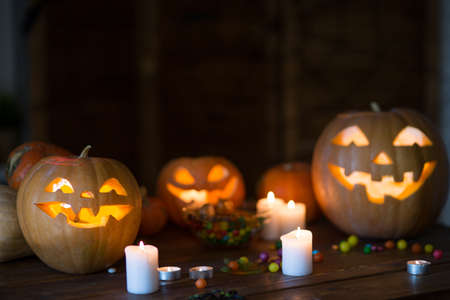 Pumpkin and candy on the table in the celebration of Halloweenの写真素材