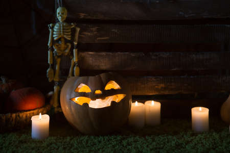 Pumpkin and candy on the table in the celebration of Halloweenの写真素材