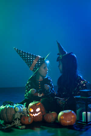 Two girls on Halloween dressed witchesの写真素材