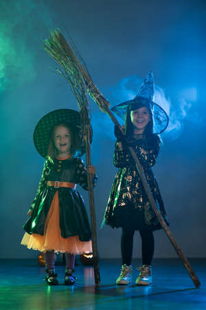 Two girls on Halloween dressed witchesの写真素材