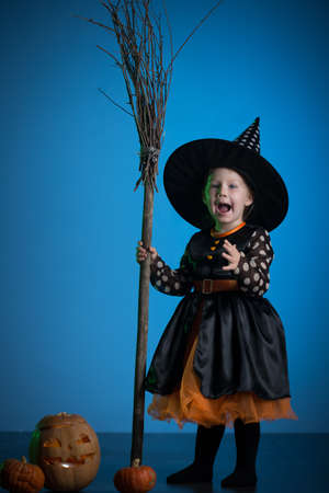 Baby in Halloween costumes, girl two years old