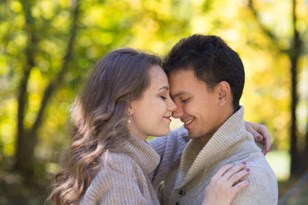 Young beautiful couple in autumn park