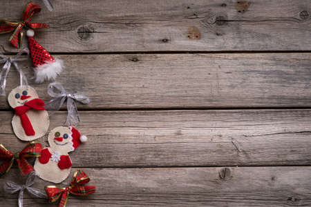 Christmas background on the fear of wooden boards, handmade toysの写真素材