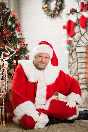 Santa Claus sitting in a roomの写真素材