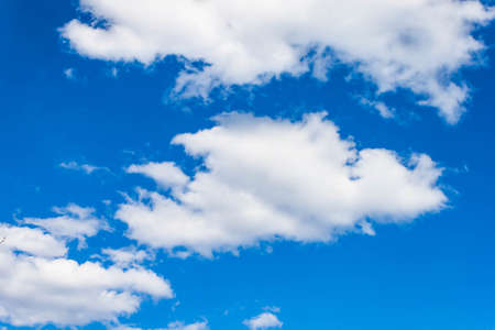 Beautiful bright Blue sky with white clouds view background texture pattern. Text copy space.の写真素材