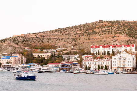 Balaklava, Sevastopol, Crimea, Russia - October 28, 2018: beautiful old marina and harbor View with Yachts, boats and embankment with old buildings in the bay of Balaclava on Black Sea.のeditorial素材