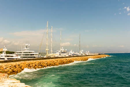 ANTIBES, FRANCE - AUGUST 07, 2019: landscape beautiful costal sea view an Antibes port full of...