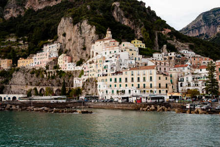 AMALFI, ITALY NOVEMBER 7 2019: Amalfi city view on houses, fortress and sea beach from the pierのeditorial素材