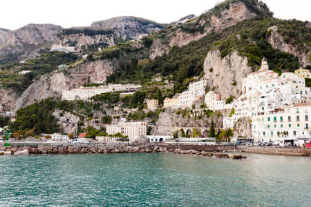 AMALFI, ITALY NOVEMBER 7 2019: Amalfi city view on houses, fortress and sea beach from the pierのeditorial素材