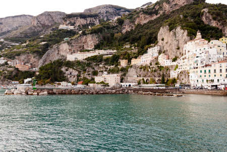 AMALFI, ITALY NOVEMBER 7 2019: Amalfi city view on houses, fortress and sea beach from the pierのeditorial素材
