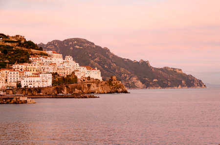 AMALFI, ITALY NOVEMBER 7 2019: Beautiful amazing Amalfi city view from the pier on the right side of the city, houses, fort and sea shore on natural background. Text copy space.のeditorial素材