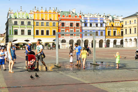 ZAMOSC, POLAND - JULY 28, 2019: colorful renaissance houses at Market Square of historical city center of Zamosc UNESCO World Heritageのeditorial素材