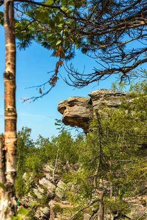 Stone city, Perm region, Russia. Turtle rock. Natural Landscape landmark reserve park on blue sky background. Down view. Selective soft focus. Shallow depth of field. Text copy space.の写真素材