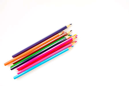 Set of colored rainbow pencils isolated on white background. Back to school painting concept. Top viewの写真素材