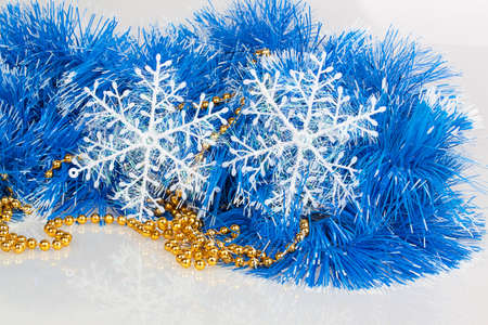 snowflakes on blue garland with gold beads