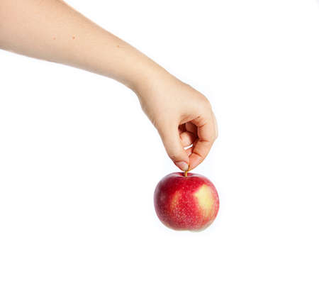 hand holding a red apple isolated on white backgroundの写真素材