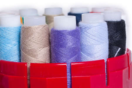 group of colored thread on a white background