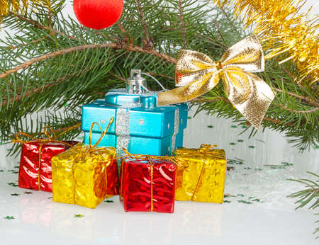 many bright Christmas gifts under the tree