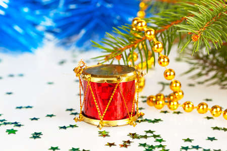 red drum under the tree with gold beadsの写真素材