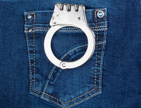 handcuffs in blue jeans pocket