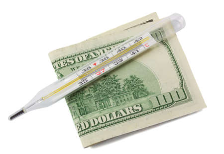glass mercury thermometer and one hundred dollars on white background