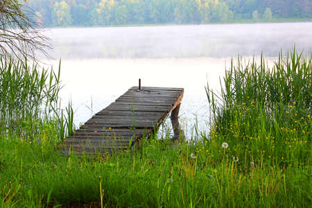 wooden dock on the riverの写真素材