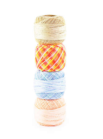 Pyramid of four skeins of yarn isolated on white background