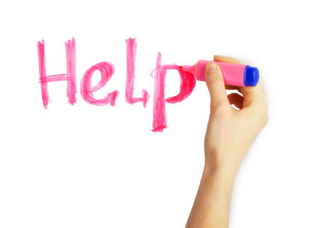 Female hand writing the word "Help" with pink marker on a white backgroundの写真素材