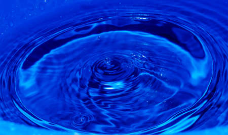 water drop splash in blueの写真素材