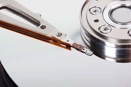 closeup of opened hard drive disk isolated on the white background